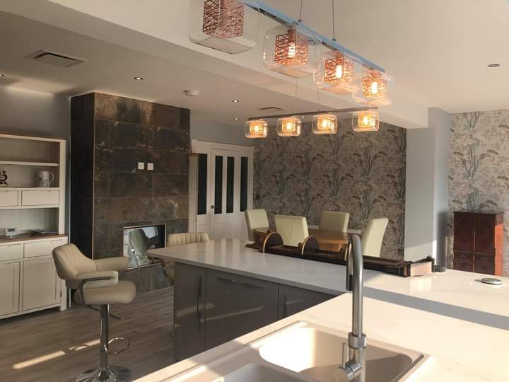Kitchen with an island and copper pendant lights